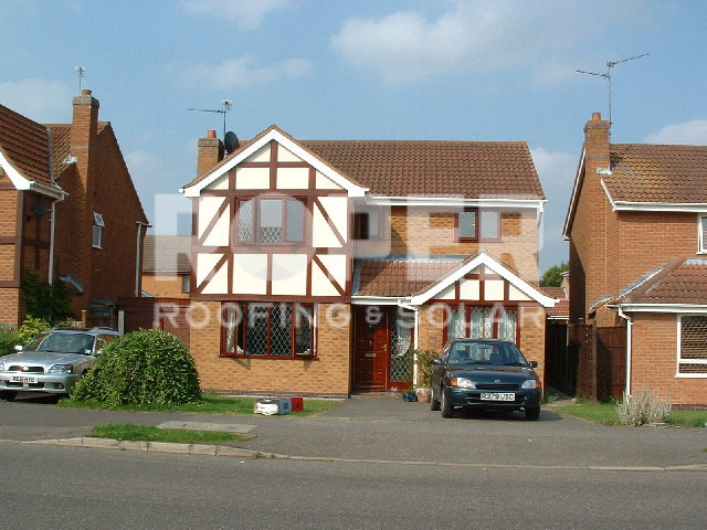 Modern Tudor-style detached house with timber framing and brick construction