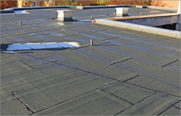 Commercial flat roof with rubber membrane roofing system and HVAC equipment